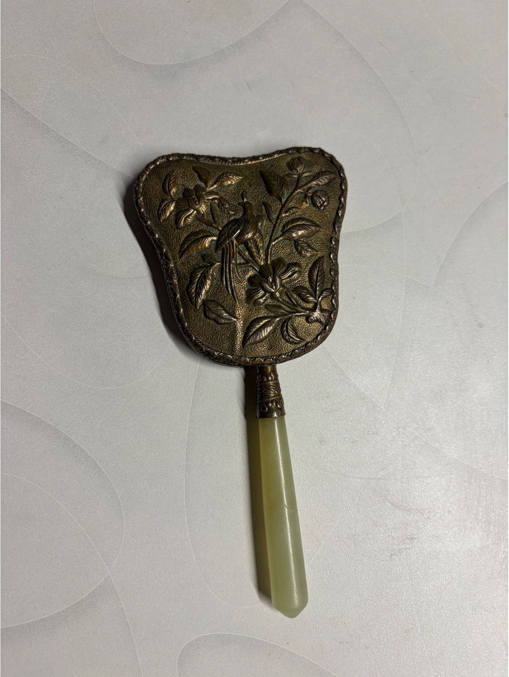 Vintage Handheld Mirror with Ornate Brass Frame and Jade Handle